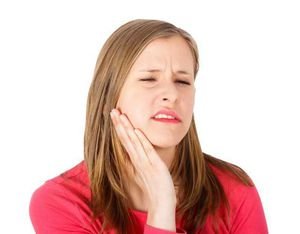 Причины болит десны после удаления зуба